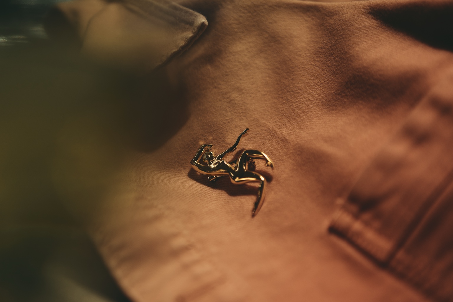 A Le Splendide pin on a staff uniform